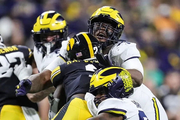Mason Graham (55), Makari Paige (7), and Jaylen Harrell (32)