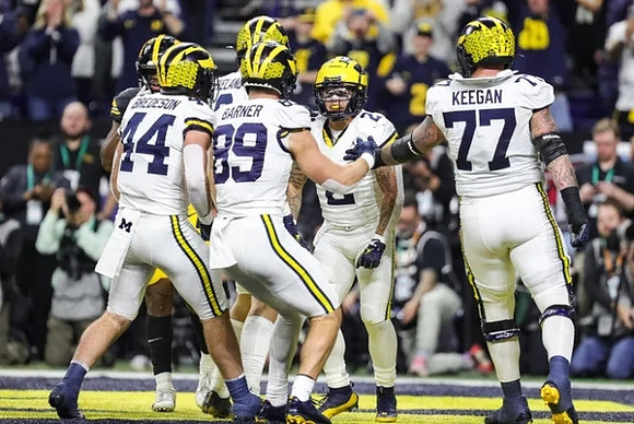 Max Bredeson (44), Colston Loveland (18), AJ Barner (89), Blake Corum (2), and Trevor Keegan (77)