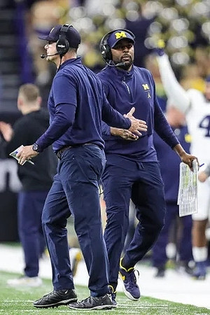 Jim Harbaugh and Sherrone Moore