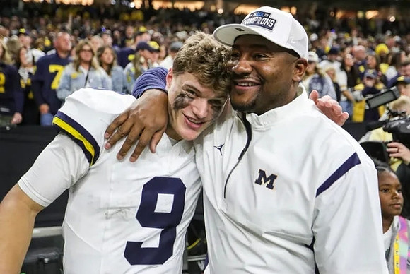 J.J. McCarthy (9) and Ron Bellamy