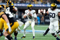J.J. McCarthy (9) and Drake Nugent (60)