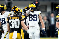 Colston Loveland (18) and AJ Barner (89)