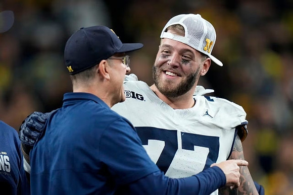 Jim Harbaugh and Trevor Keegan (77)
