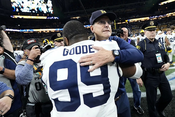 Cam Goode (99) and Jim Harbaugh