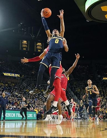 Dug McDaniel (0), Kobe Bufkin (2), Jett Howard (13), and Juwan Howard