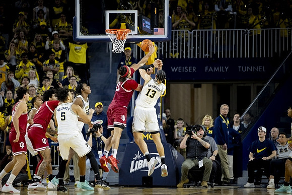 Terrance Williams II (5), Tarris Reed Jr. (32), and Olivier Nkamhoua (13)