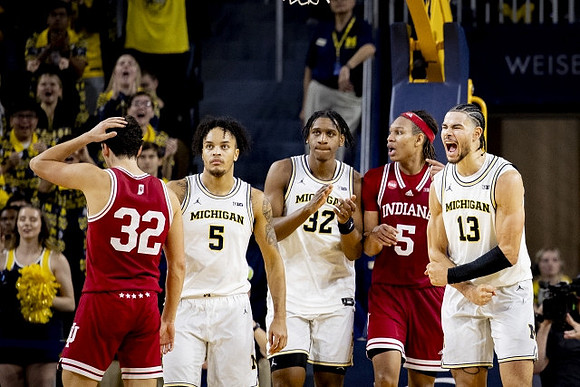 Terrance Williams II (5), Tarris Reed Jr. (32), and Olivier Nkamhoua (13)