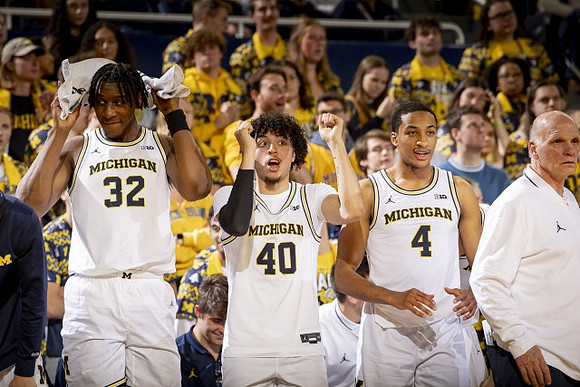 Tarris Reed Jr. (32), George Washington III (40), Nimari Burnett (4), and Phil Martelli