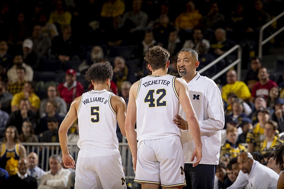Terrance Williams II (5), Will Tschetter (42), and Juwan Howard