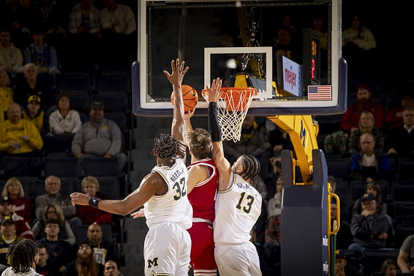 Tarris Reed Jr. (32) and Olivier Nkamhoua (13)
