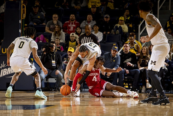Dug McDaniel (0), Olivier Nkamhoua (13), and Terrance Williams II (5)