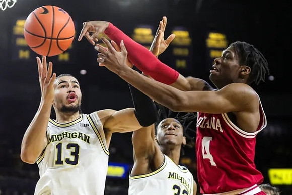 Olivier Nkamhoua (13) and Tarris Reed Jr. (32)