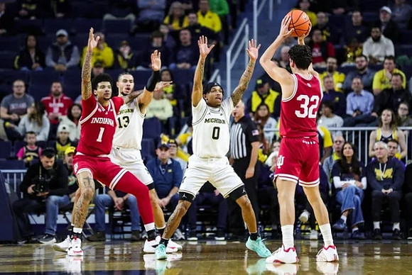 Olivier Nkamhoua (13) and Dug McDaniel (0)