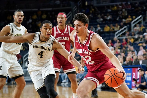 Olivier Nkamhoua (13) and Nimari Burnett (4)