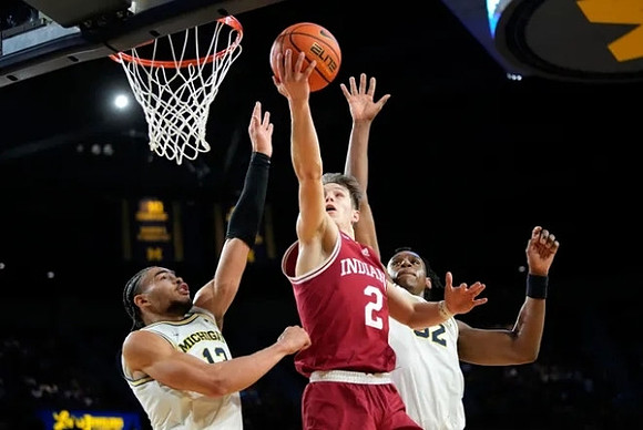 Olivier Nkamhoua (13) and Tarris Reed Jr. (32)