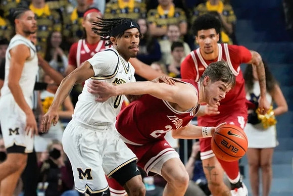 Olivier Nkamhoua (13) and Dug McDaniel (0)