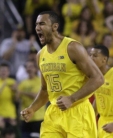 Jon Horford (15) and Trey Burke (3)