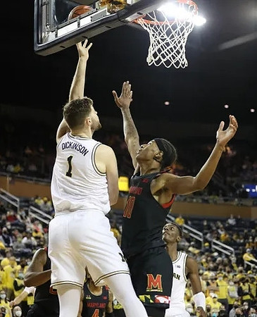 Hunter Dickinson (1) and Moussa Diabate (14)