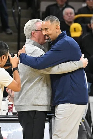 Iowa Head Coach Fran McCaffery and Juwan Howard