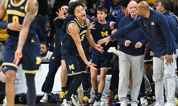 Terrance Williams II (5) and Michigan Team