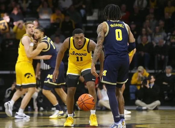Olivier Nkamhoua (13) and Dug McDaniel (0)