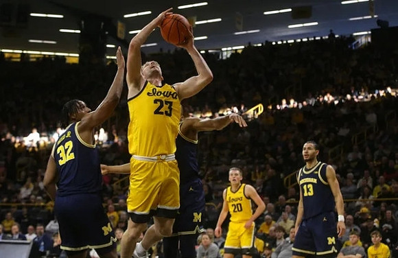 Tarris Reed Jr. (32) and Olivier Nkamhoua (13)