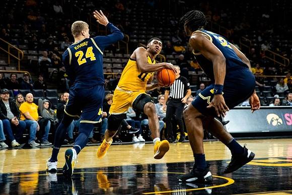 Youssef Khayat (24) and Tarris Reed Jr. (32)