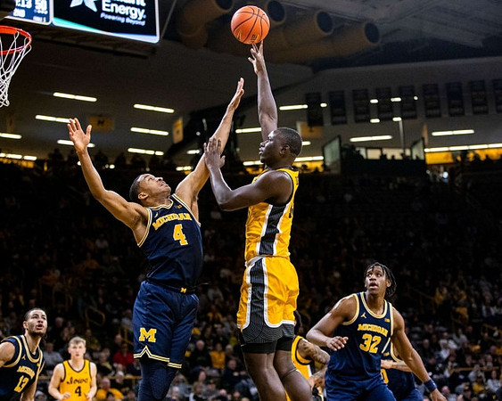Olivier Nkamhoua (13), Nimari Burnett (4), and Tarris Reed Jr. (32)