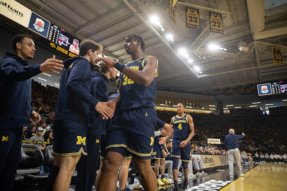 Tarris Reed Jr. (32) and Michigan Team