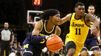Dug McDaniel (0) and Olivier Nkamhoua (13)