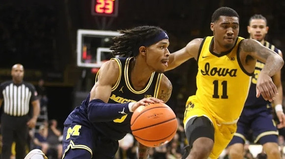 Dug McDaniel (0) and Olivier Nkamhoua (13)