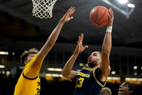 Olivier Nkamhoua (13) and Tarris Reed Jr. (32)