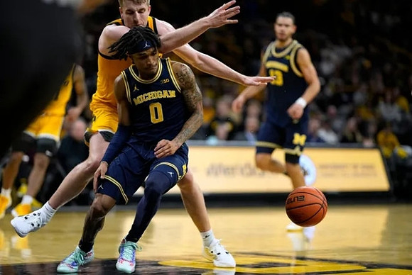 Dug McDaniel (0) and Olivier Nkamhoua (13)