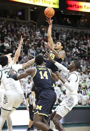 Moussa Diabate (14) and Eli Brooks (55)