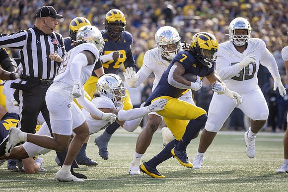 Myles Hinton (78) and Donovan Edwards (7)