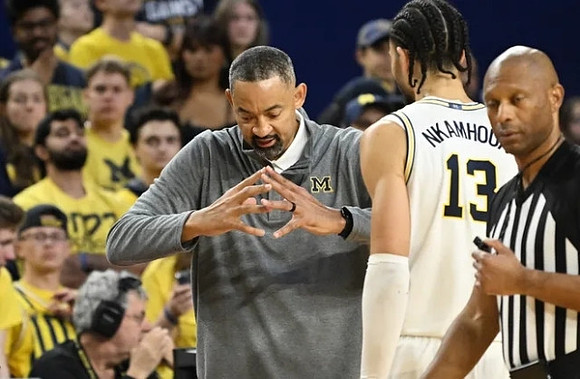 Juwan Howard and Olivier Nkamhoua (13)