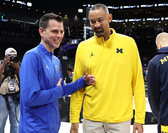 Florida Head Coach Todd Golden  and Juwan Howard