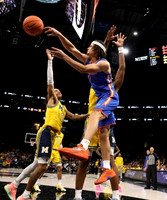 Dug McDaniel (0) and Olivier Nkamhoua (13)