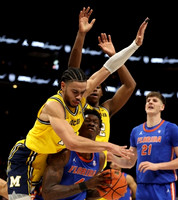 Olivier Nkamhoua (13) and Tarris Reed Jr. (32)