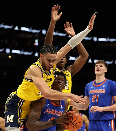 Olivier Nkamhoua (13) and Tarris Reed Jr. (32)