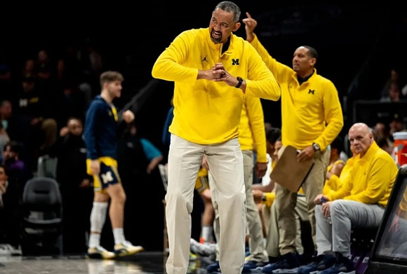 Juwan Howard, Howard Eisley, and Phil Martelli