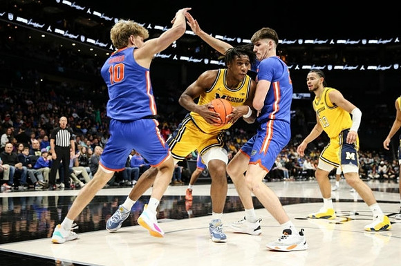 Tarris Reed Jr. (32) and Olivier Nkamhoua (13)