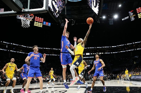 Olivier Nkamhoua (13), Nimari Burnett (4), Tarris Reed Jr. (32), and Dug McDaniel (0)