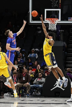 Olivier Nkamhoua (13) and Tarris Reed Jr. (32)