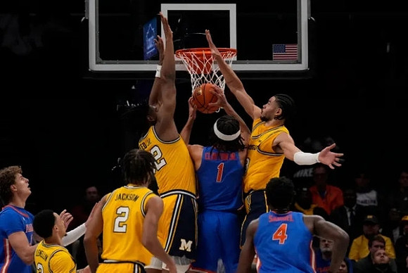 Jaelin Llewellyn (3), Tray Jackson (2), Tarris Reed Jr. (32), and Olivier Nkamhoua (13)