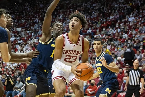 Brandon Johns Jr. (23), Moussa Diabate (14), and Caleb Houstan (22)