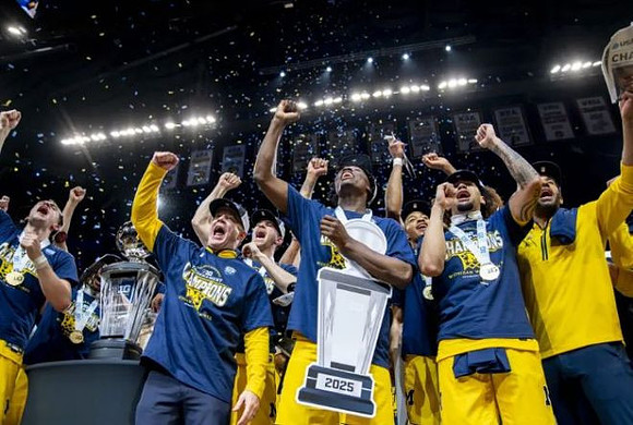 Dusty May, Michigan Team, and Big Ten Tournament Championship Trophy