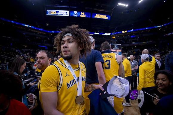 Tre Donaldson (3) and Michigan Team