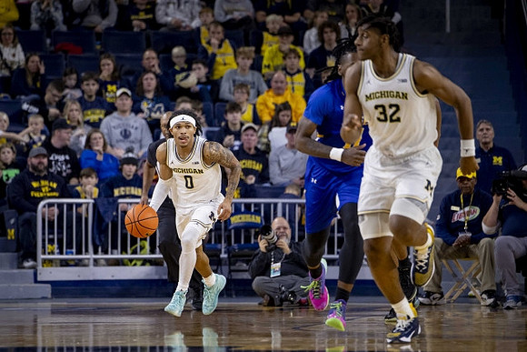 Dug McDaniel (0) and Tarris Reed Jr. (32)