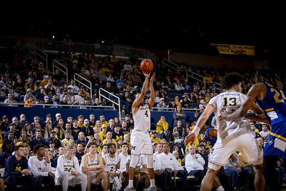 Nimari Burnett (4) and Olivier Nkamhoua (13)